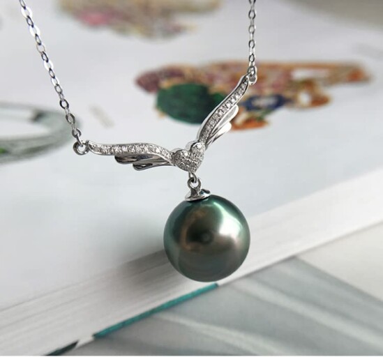 Elegant Tahitian Black Pearl Necklace displayed on a model