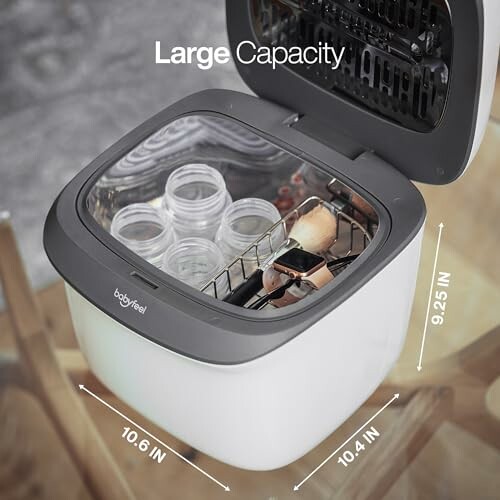 Open baby bottle sterilizer showing large capacity with bottles inside.