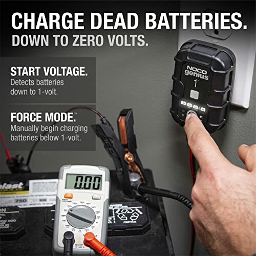 Using a NOCO Genius charger to charge a dead battery with a multimeter reading zero volts.