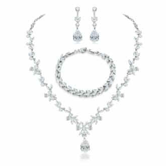Elegant diamond necklace, bracelet, and earrings set.