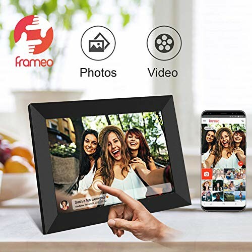 Digital photo frame displaying a group selfie, with smartphone app interface shown.