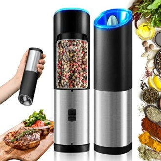 Electric pepper grinder set with peppercorns, spices, and steak.