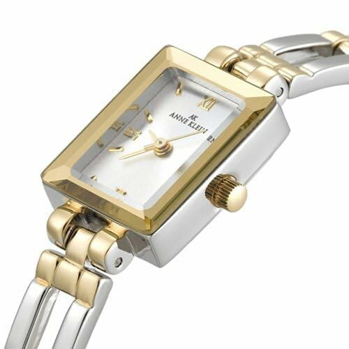 Elegant gold and silver women's watch with rectangular face.