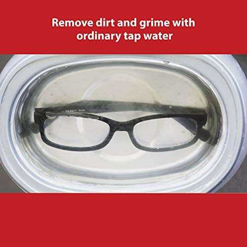 Glasses submerged in water for cleaning.