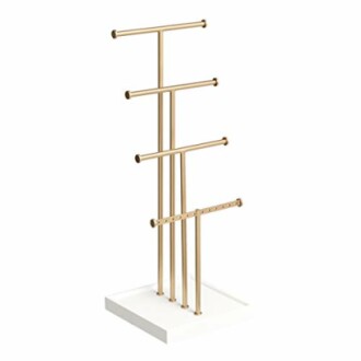 Gold jewelry stand with multiple tiers on white base.