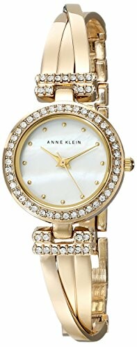 Elegant gold Anne Klein women's watch with crystal accents and mother-of-pearl dial.