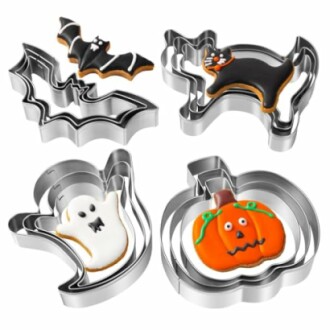 Set of Halloween-themed cookie cutters and decorated cookies.