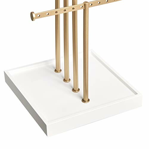 Gold jewelry holder stand with white base.