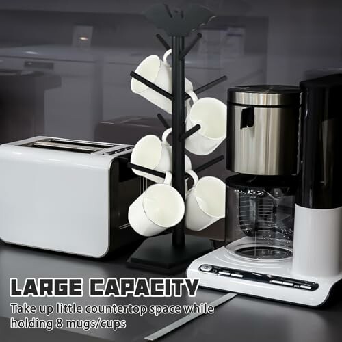 Toaster, coffee maker, and mug tree holding white cups on a countertop.
