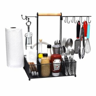 Kitchen organizer with utensils, paper towel, and condiments.