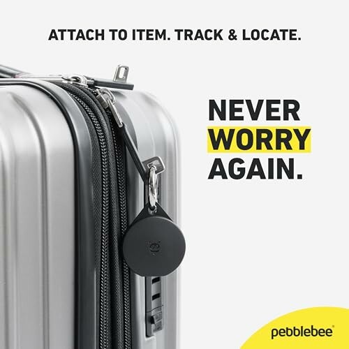 Black tracking device attached to silver luggage.