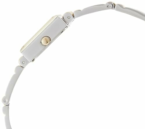 Side view of a minimalist wristwatch with a thin metal band.