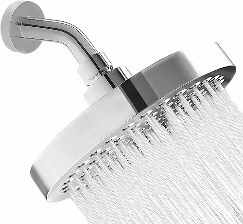 Close-up of a modern showerhead with water flowing.