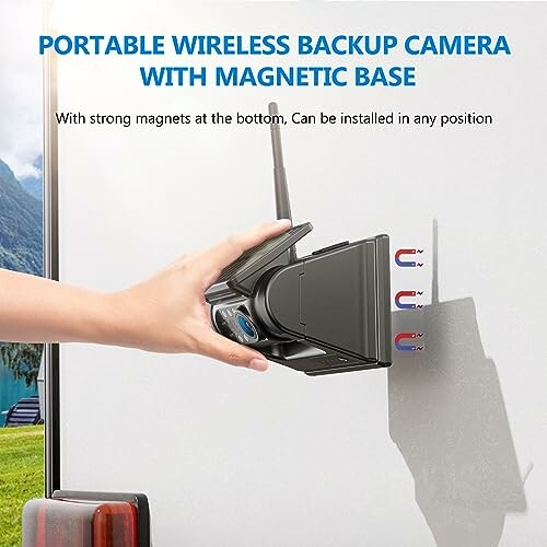 Hand attaching portable wireless backup camera with magnetic base to a surface.
