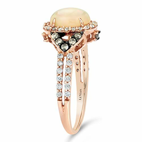 Rose gold ring with diamonds and central gemstone.