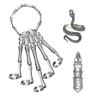 Skeleton hand ring set with snake and crocodile designs.