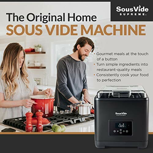 Couple cooking with Sous Vide Supreme machine in kitchen.