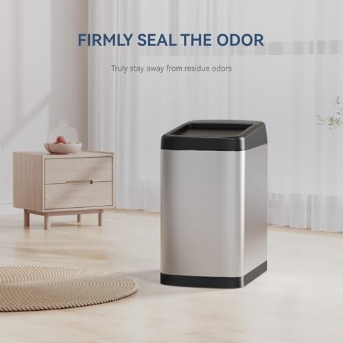 Stainless steel trash can with odor sealing feature in modern room.