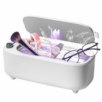 Ultrasonic cleaner with glasses, watch, and dental items.