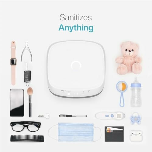 UV sanitizer with various items including phone, glasses, mask, and baby bottle.