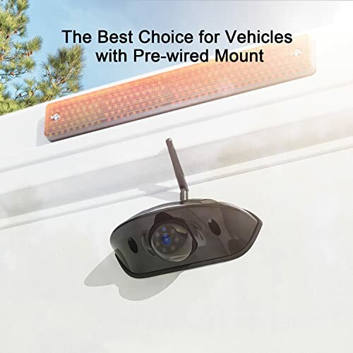 Vehicle backup camera mounted with pre-wired setup.